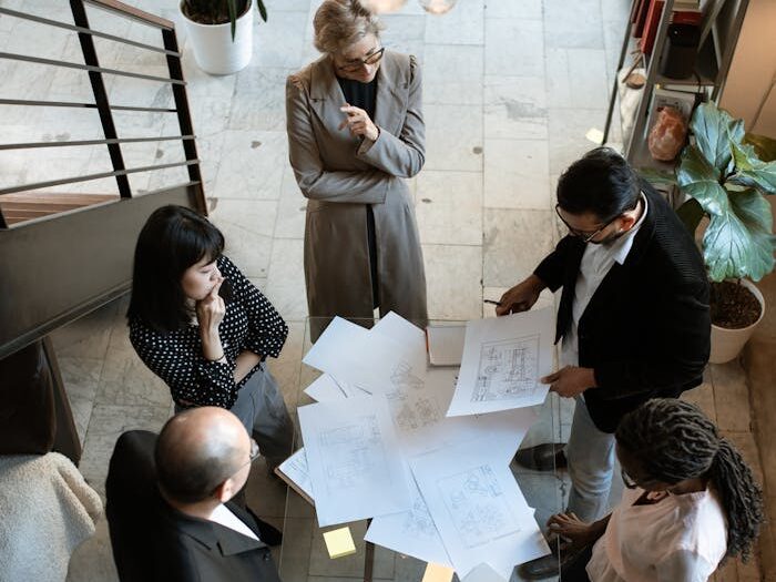 People Sitting on Chair in Front of Table