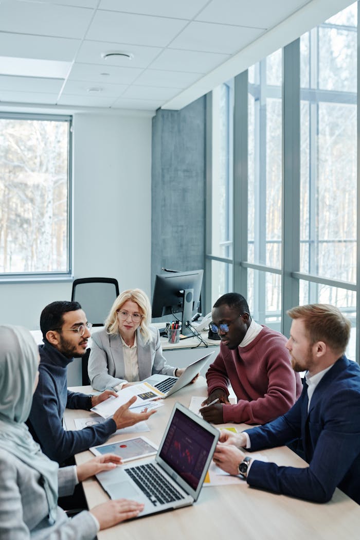 Office Team Sitting at the Table